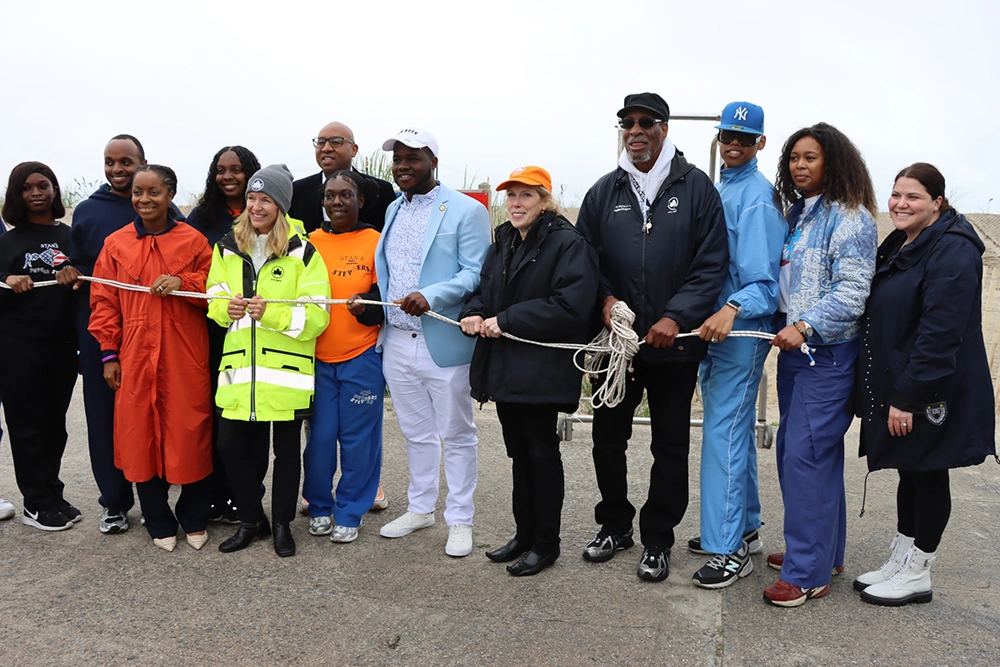 Shoni Rozenberg Seide, DO, FAAD, Associate Dermatology Program Director at Episcopal Health Services (right), announced EHS’ partnership with IMPACT Melanoma to provide sunscreen dispensers at Rockaway Beaches when she joined NYC Parks Department personnel, city officials and New York City lifeguards in celebrating the opening of beach season.