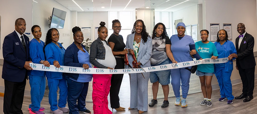Jacqueline Marecheau, MD, FACOG, chair of OB-GYN at EHS (center), cut the ribbon alongside expectant mothers and team members.