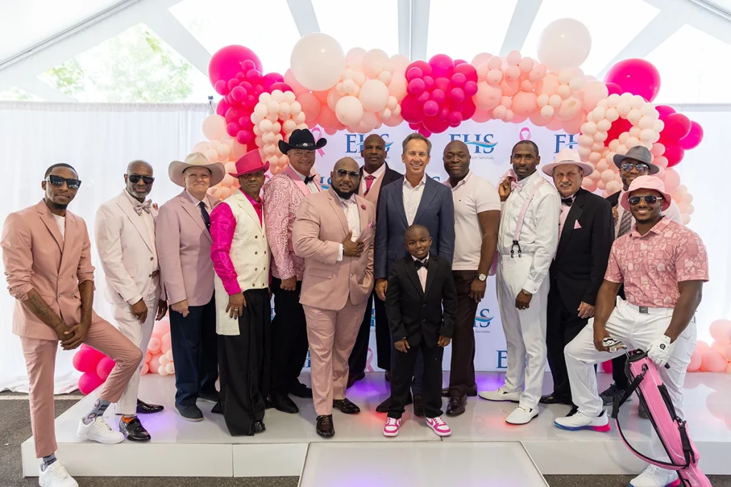 Episcopal Health Services’ Chief Executive Officer, Donald T. Morrish, MD, MMM (center), poses with ambassadors at the “Real Men Wear Pink” fashion show.