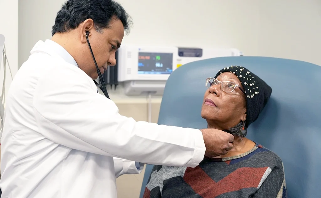 Dr. Khurana examines a patient