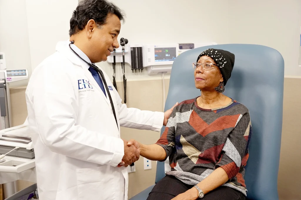 Dr. Khurana examines a patient